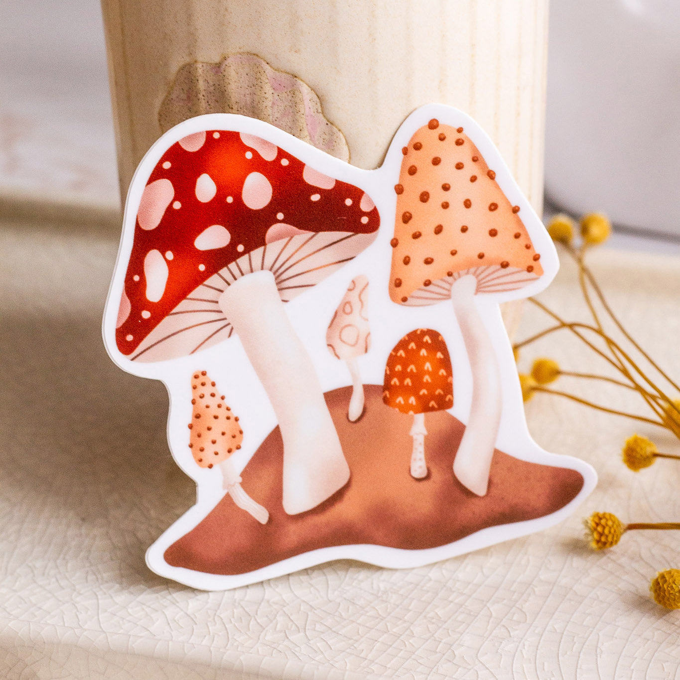 Wild Mushrooms Vinyl Sticker leaning against beautiful home decor