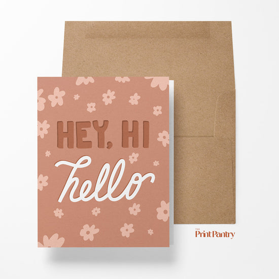 Hey, Hi, Hello Greeting Card laying on an open Kraft paper envelope