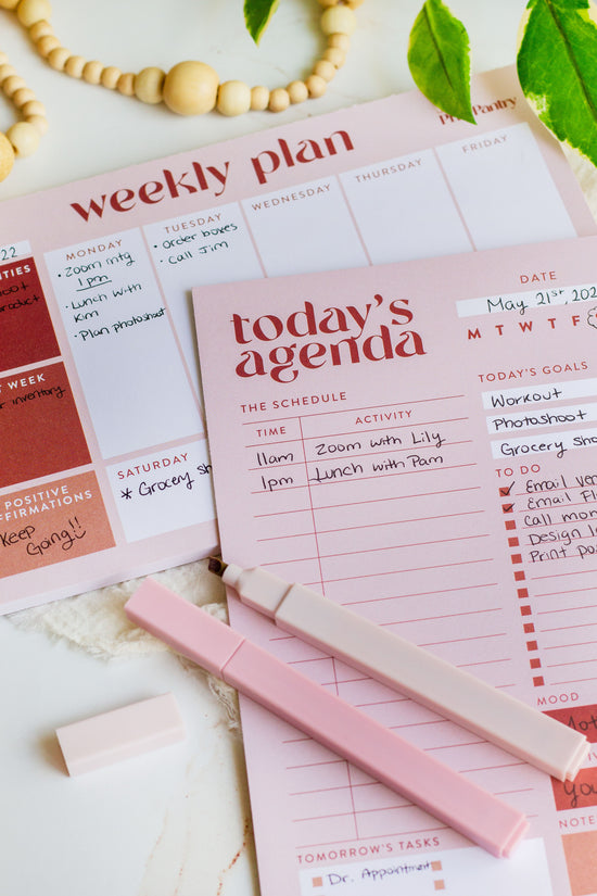 The Agenda Notepad Bundle laying next to markers