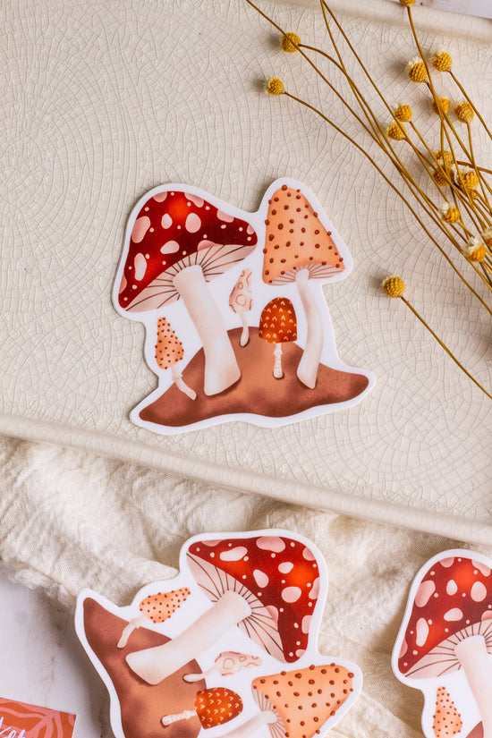 Load image into Gallery viewer, Forest Mushroom Vinyl Sticker laying on decorative tray

