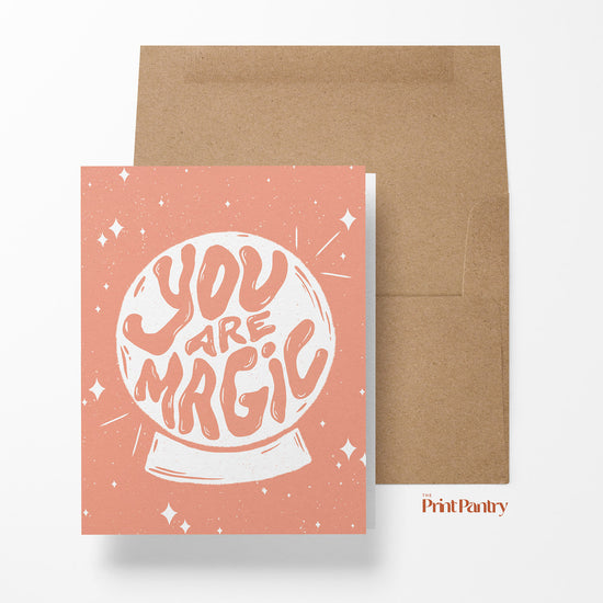 You Are Magic Greeting Card laying on an open Kraft paper envelope