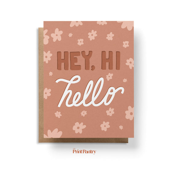 Hey, Hi, Hello Greeting Card laying on Kraft paper envelope