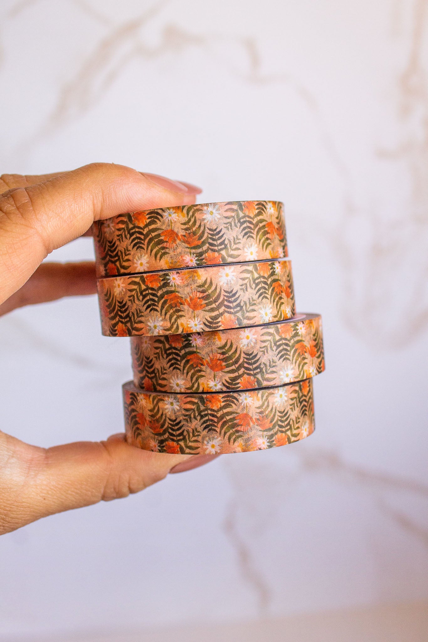 Woman holding a stack of Summer Blooms Washi Tape