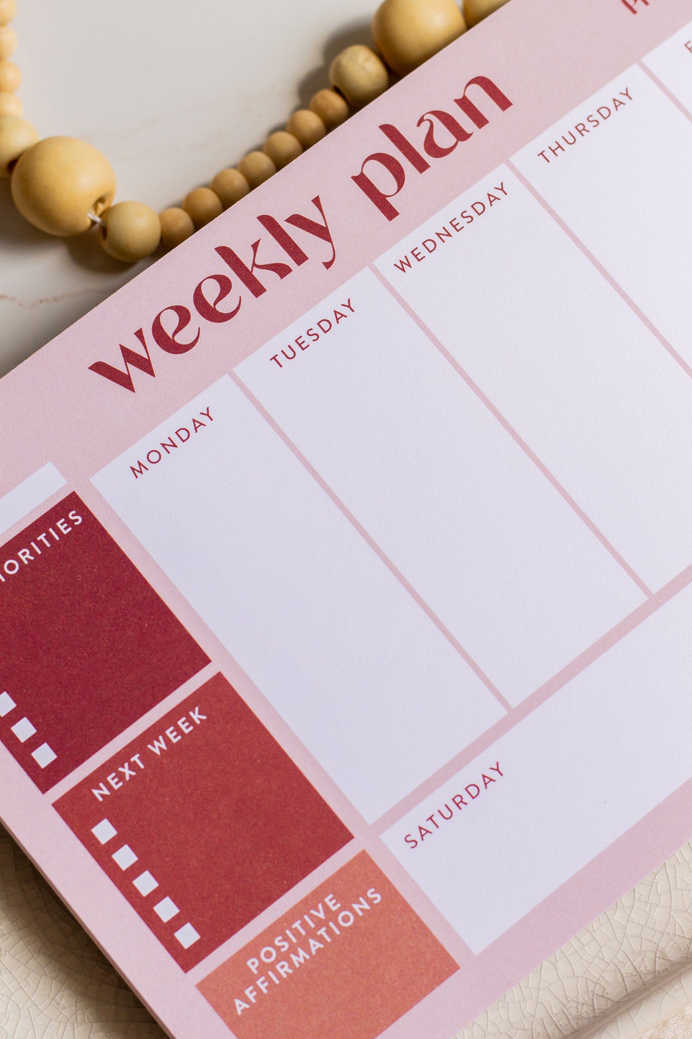 Weekly Plan Notepad laying on a decorative tray